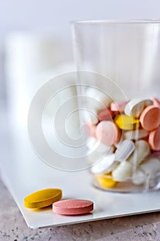 Different pills in a cup - health care system