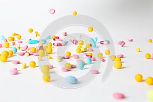 Different pills falling on table