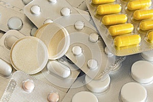 Different pills in plastic packaging