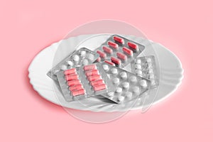 Different pills on a plate. The concept of prescription drugs for weight loss. Means for suppressing appetite