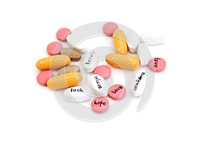 Different pills with signs on white