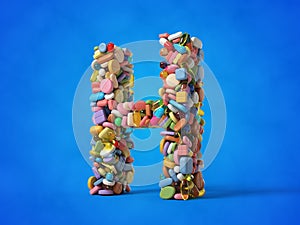 different pills stack in shape of letter H.