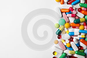 Different pills on white background