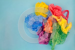 Different plastic bags on blue background.