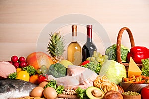 Different products on wooden background, closeup. Healthy food and balanced diet