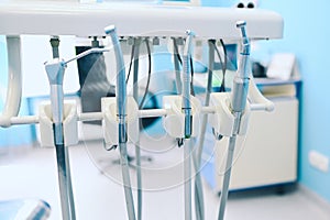 Different professional dental equipment, instruments and tools in a dentists stomatology office clinic