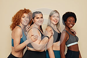 Different Race. Diversity Figure And Size Women Portrait. Smiling Multicultural Friends In Sportswear Posing.