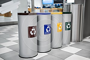 Different recycling bins for trash in shopping mall