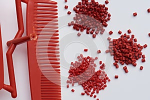 Different red plastic resins with processed comb