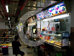 Different restaurants in a typical Singapore food court or Hawker