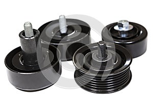 Different rollers for car engine as idler pulley, jockey roller, gallow pulley. Isolated on a white background