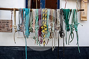 Different ropes hanging in front of a building in Aurdesselles Fance