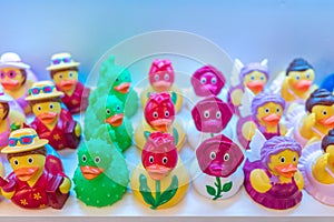 Different rubber ducks on the shelf in the store