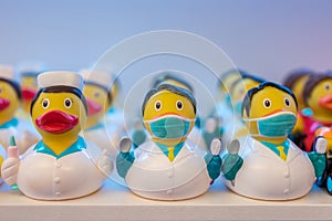 Different rubber ducks on the shelf in the store
