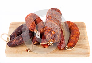 Different salami on a white background