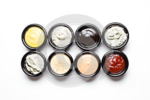 Different sauces in assortment in black sauces