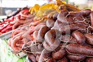 Different sausages for sale in a farmer`s market in Colombia.