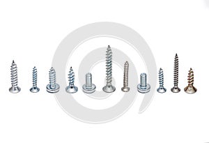 Different screws and bolts on a white background