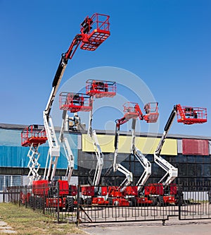 Different self propelled articulated boom lifts and one scissor lift