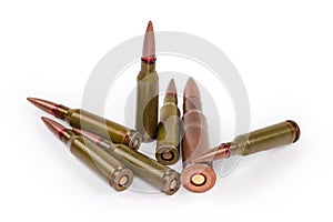 Different service rifle cartridges on a white background