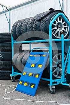 Different sets of racing tyres in a motorsport box