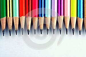 Different Sharpened Colorful Pencils and erasers