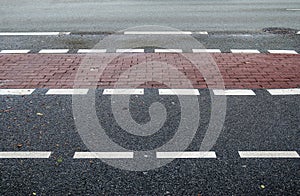 Different signs and marking painted on the ashpalt of streets and roads