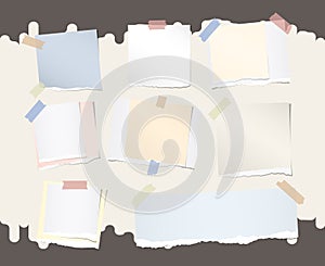 Different size colorful note, notebook, copybook paper stuck with sticky tape on brown background