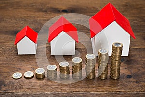 Different Size Houses With Coins