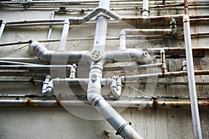 DIfferent sizes plastic pipes connected from different flats