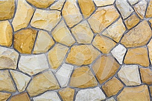 Different sizes of sand stones. Stone wall pattern background
