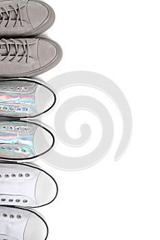 Different sneakers on white background