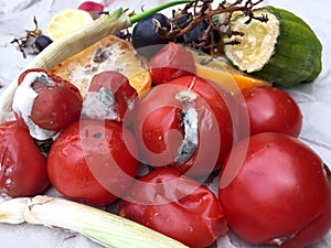 Different sorts of rotten fruit and vegetables