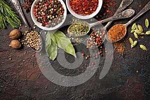 Different spices, dry kitchen herbs and seeds for tasty meals