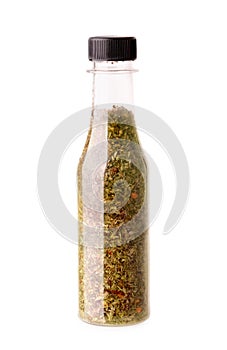 Different spices and herbs in a botle