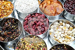 Different spices and herbs in metal bowls on a street market in Kolkata