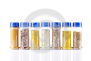 Different spices jars and pepper mill