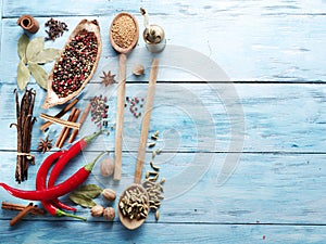 Different spices on old wood.