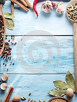 Different spices on old wooden table.
