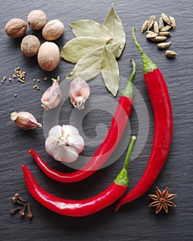 Different spices on rocked table.