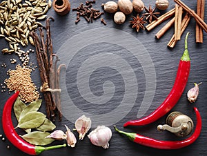 Different spices on rocked table.