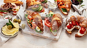 Different stuffed croissant. Croissant sandwich variety