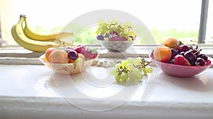 Different Summer fruits on a window sill