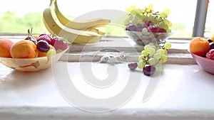 Different Summer fruits on a window sill