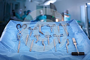 Different surgical instruments on table in operating room