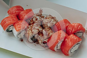 Different sushi delivery. Varieties of sushi for lunch or dinner.