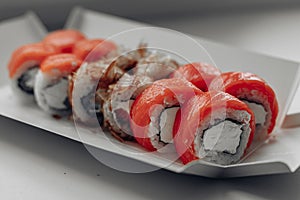 Different sushi delivery. Varieties of sushi for lunch or dinner.