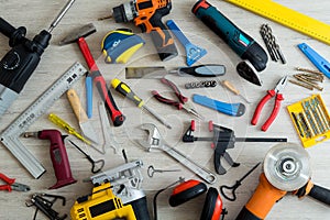 Different tools on a light wooden background