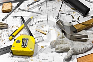 Different tools are lying on carpenter workbench.