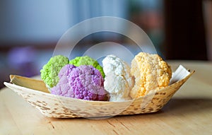 Different type of cauliflowers in a bamboo bowl